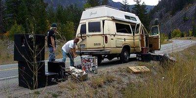 VANCOUVER, BC- MAY 15-2008 - Bill Johnston changes a tire on his band's touring van near Princeton, British Columbia in 2006. The van was used by Terry Fox during his Marathon of Hope. Photo by Ernie Hawkins