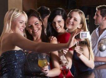 Young women drinking at bar